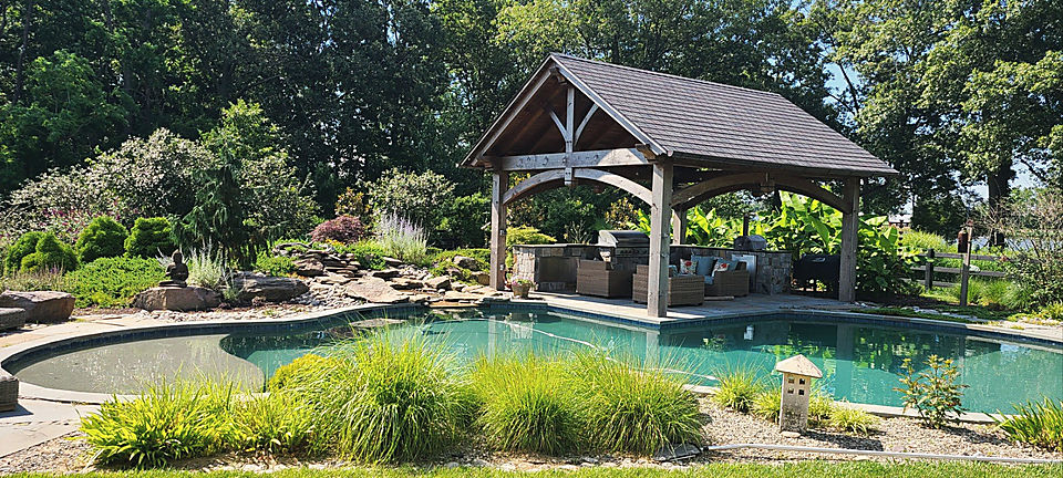 The same pool garden grown in around the stone