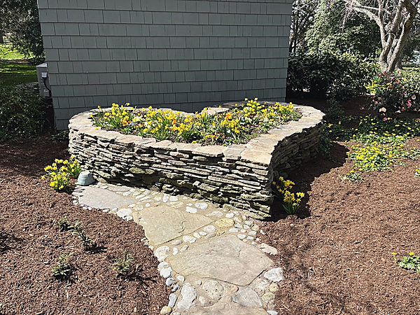 A dry stacked stone bed